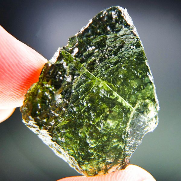 Certified Moldavite with natural breaks