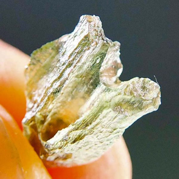 Moldavite with open bubble