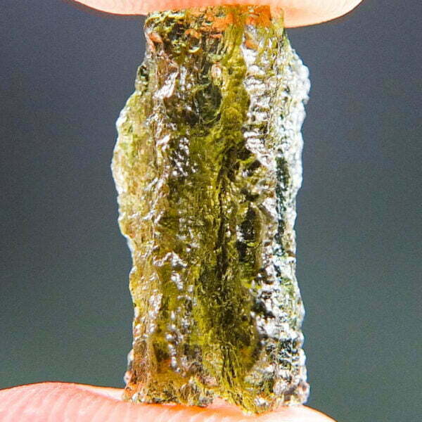 Moldavite with brown color and imprint of bubble