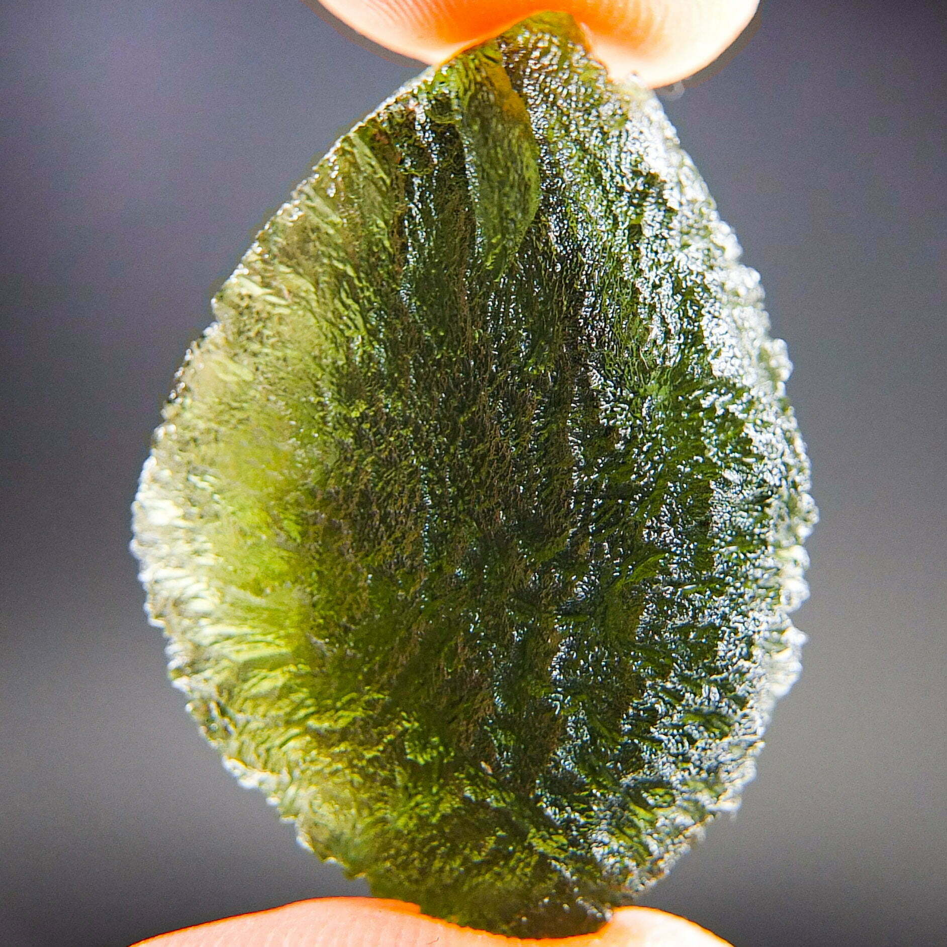 Rare Certified Moldavite – Elipsoid – natural fragment shape with long channel filled by clay –