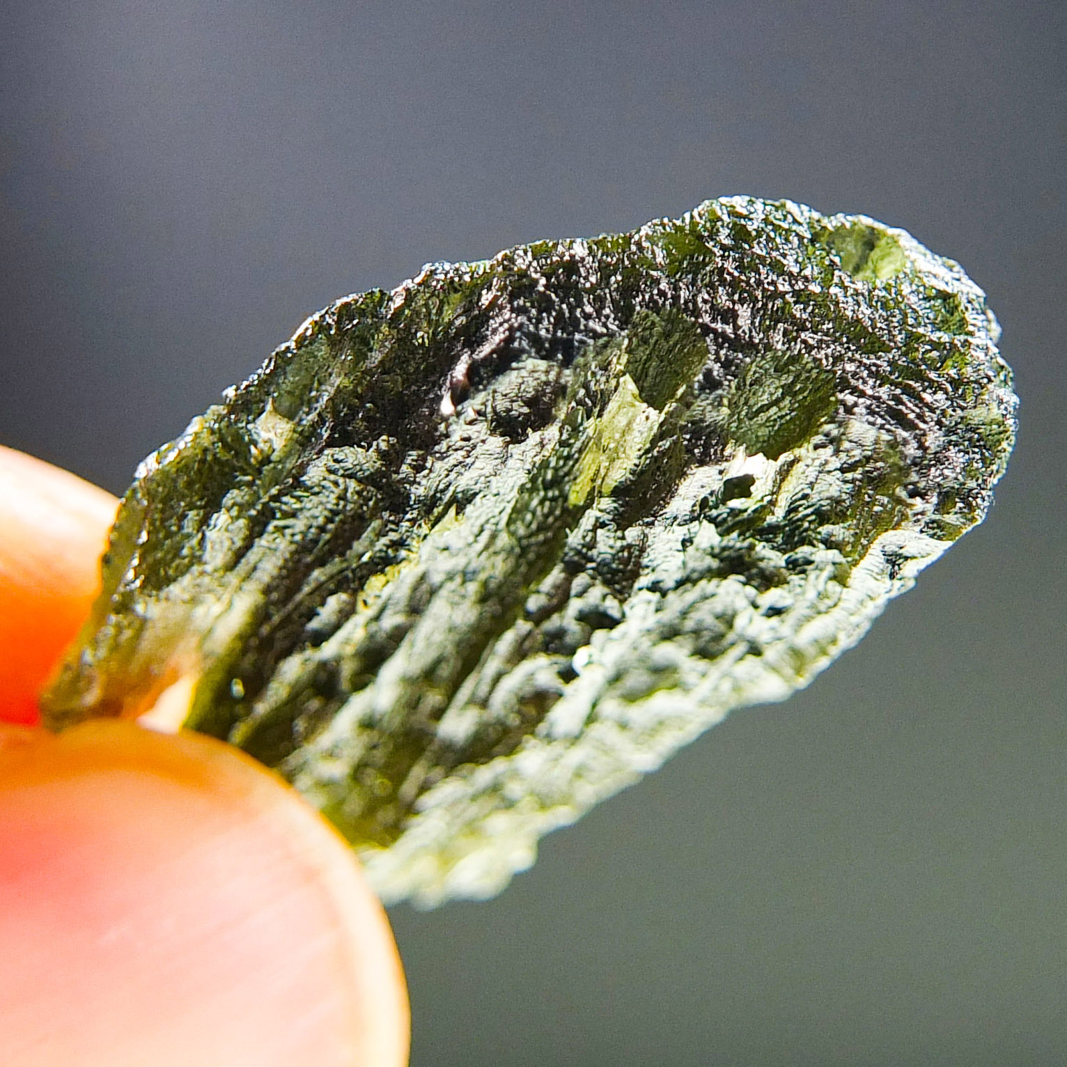 Moldavite with closed and open bubbles - Certified