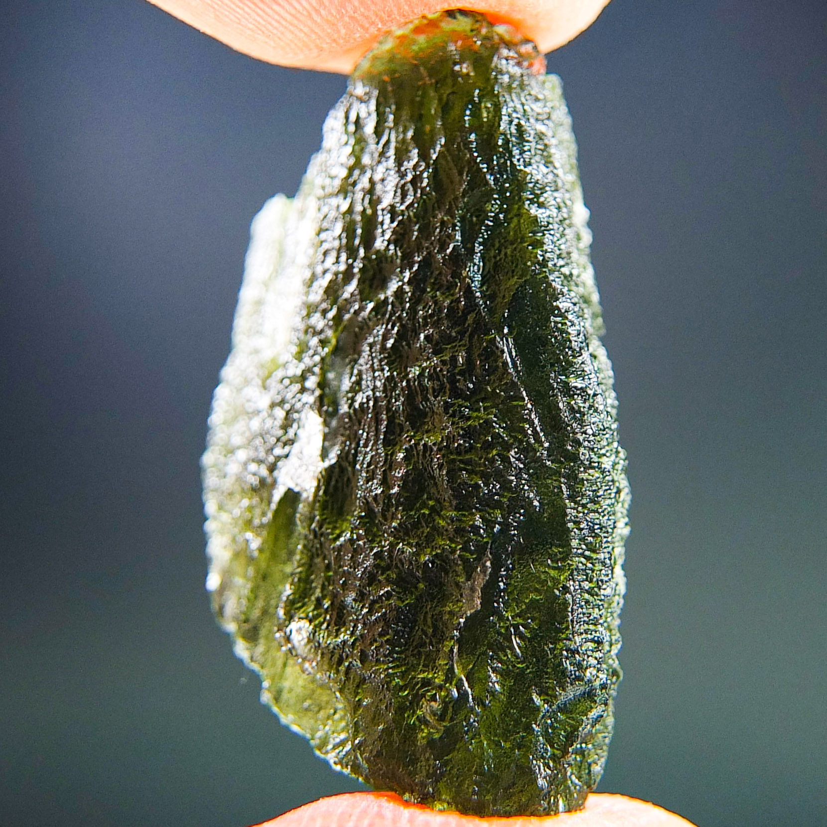 Moldavite with closed and open bubbles - Certified